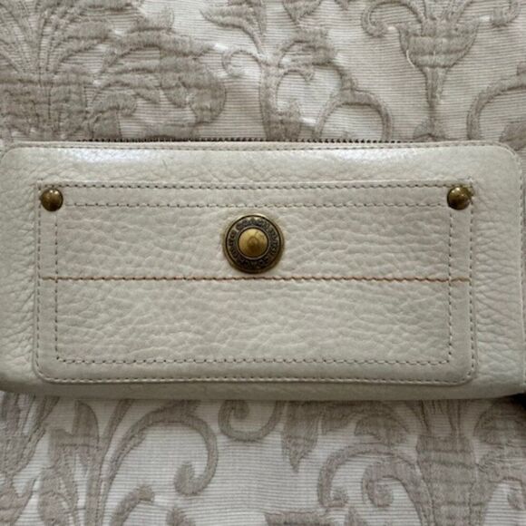 Coach Ivory Pebble leather zip around continental wallet.